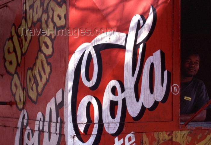 mozambique174: Mozambique / Moçambique - Maputo / Lourenço Marques / MPM : man in Coca-Cola hut / barraca da Coca Cola (photo by F.Rigaud) - (c) Travel-Images.com - Stock Photography agency - Image Bank