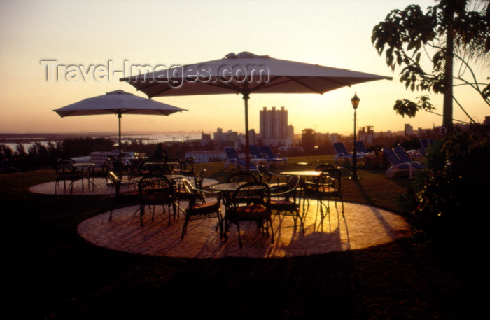 mozambique216: Mozambique / Moçambique - Maputo / Lourenço Marques: Cardoso Hotel - parasols and view over the city and the harbour / esplanada do Hotel Cardoso - photo by F.Rigaud - (c) Travel-Images.com - Stock Photography agency - Image Bank