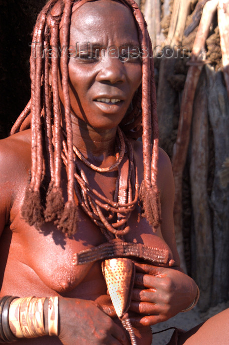 namibia151: Namibia: Himba Woman Smearing ochre on herself, Skeleton Coast, Kunene region - photo by B.Cain - (c) Travel-Images.com - Stock Photography agency - Image Bank