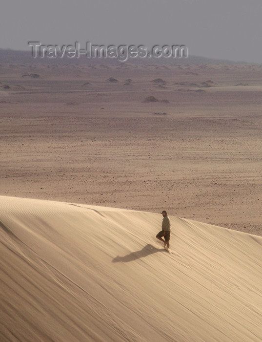 namibia165: Namibia: Man walking on sand dune, Skeleton Coast - photo by B.Cain - (c) Travel-Images.com - Stock Photography agency - Image Bank