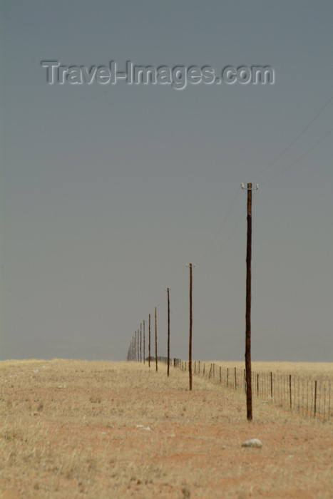 namibia26: Namibia: great expanse - endless phone line and fence - photo by J.Banks - (c) Travel-Images.com - Stock Photography agency - Image Bank