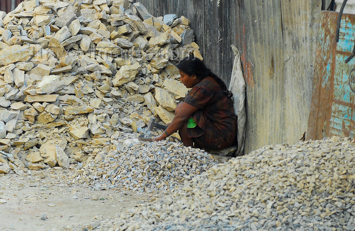 nepal131: Kathmandu, Nepal: woman breaking stones with a hammer - manual production of gravel for roads - photo by E.Petitalot - (c) Travel-Images.com - Stock Photography agency - Image Bank