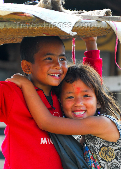 nepal140: Kathmandu, Nepal: smiling brother & sister - photo by E.Petitalot - (c) Travel-Images.com - Stock Photography agency - Image Bank