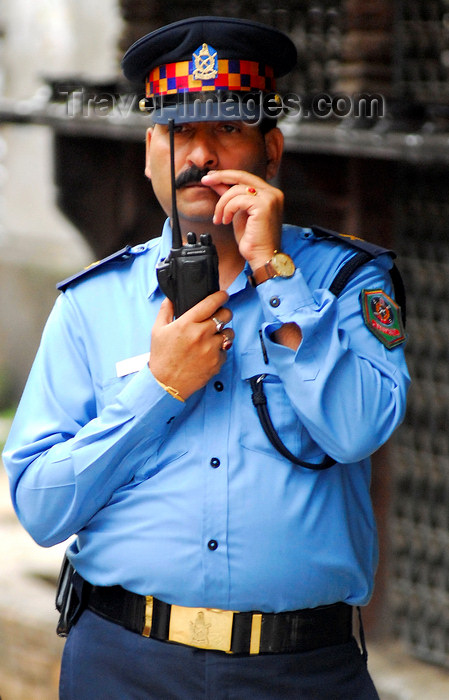 nepal142: Kathmandu, Nepal: police chief with a walkie-talkie - photo by E.Petitalot - (c) Travel-Images.com - Stock Photography agency - Image Bank