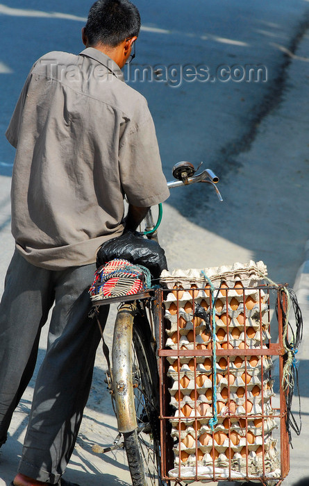 nepal166: Pokhara, Nepal: an eggs' merchant and his bike - photo by E.Petitalot - (c) Travel-Images.com - Stock Photography agency - Image Bank