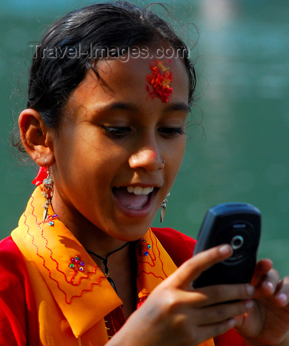 nepal183: Pokhara, Nepal: a Nepali girl happy with her mobile phone - photo by E.Petitalot - (c) Travel-Images.com - Stock Photography agency - Image Bank