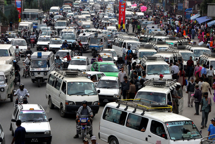 nepal191: Kathmandu, Nepal: traffic on Kantipath Rd - photo by J.Pemberton - (c) Travel-Images.com - Stock Photography agency - Image Bank