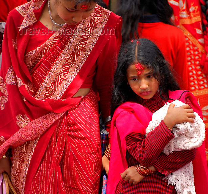 nepal202: Kathmandu, Nepal: woman and daughter at Teej, the Hindu women's festival, celebrated for marital felicity, well-being of family and purgation of own body and soul - photo by J.Pemberton - (c) Travel-Images.com - Stock Photography agency - Image Bank