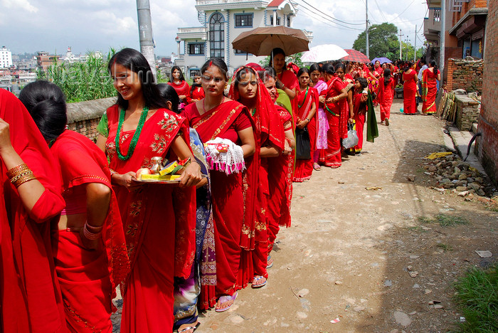 nepal204: Kathmandu, Nepal: women with with offerings of flowers and fruits (prasadam) queue to enter Koteshwar temple, during women's festival - Teej - photo by J.Pemberton - (c) Travel-Images.com - Stock Photography agency - Image Bank