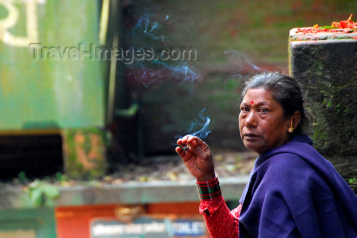 nepal229: Kathmandu valley, Nepal: Dakshinkali temple complex, dedicated to the Hindu goddess Kali - local woman smoking - photo by J.Pemberton - (c) Travel-Images.com - Stock Photography agency - Image Bank