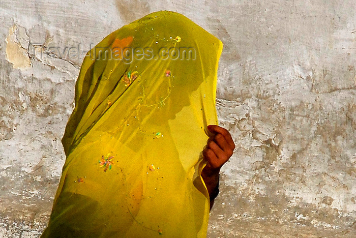 nepal232: Kathmandu, Nepal: woman in yellow sari shielding her face from the sun - photo by J.Pemberton - (c) Travel-Images.com - Stock Photography agency - Image Bank