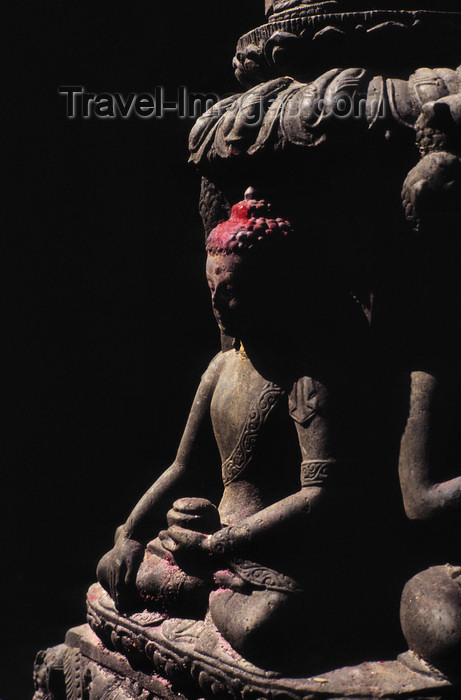 nepal239: Kathmandu, Nepal: Buddha statue at a votive stupa - in Nepal there are countless votive stupas - they arrived in the 8th Century and often include images of the four Jina Buddhas in the four cardinal directions - they are found in the courtyards of monasteries and secular buildings, streets and squares - photo by W.Allgöwer - (c) Travel-Images.com - Stock Photography agency - Image Bank