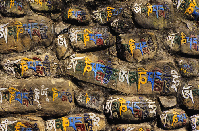 nepal241: Kathmandu, Nepal: wall of Mani stones - rocks inscribed with a mantra - Tibetan Buddhism - photo by W.Allgöwer - (c) Travel-Images.com - Stock Photography agency - Image Bank