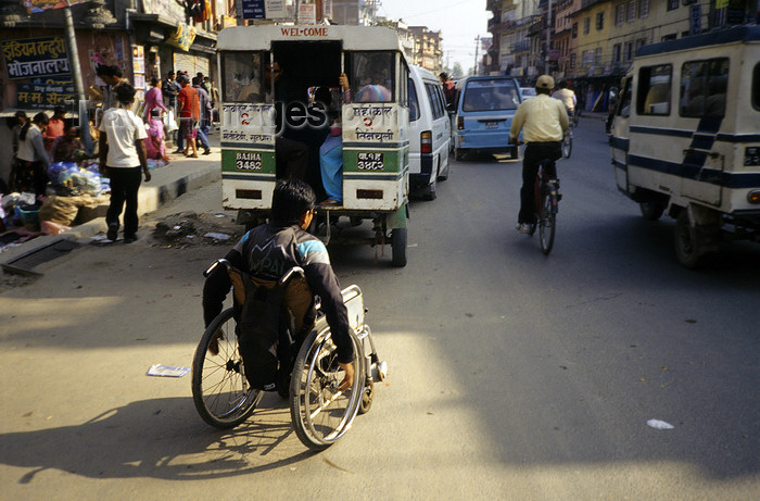 nepal251: Kathmandu, Nepal: using a wheelchair on a busy street - photo by W.Allgöwer - (c) Travel-Images.com - Stock Photography agency - Image Bank