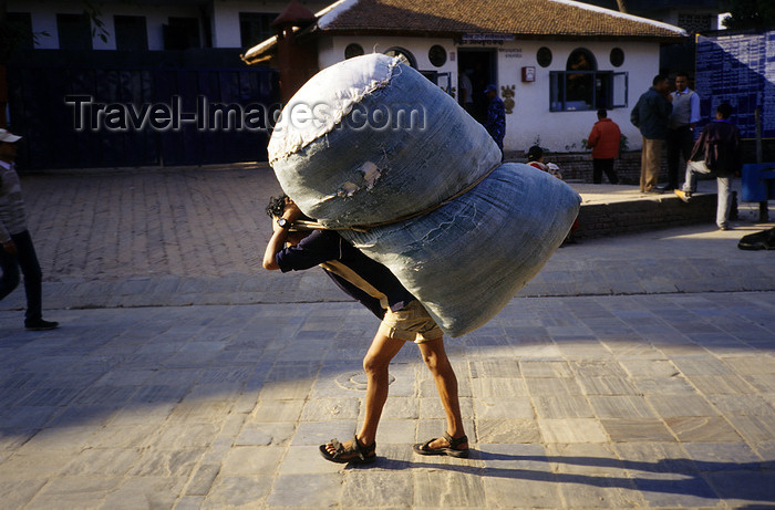 nepal252: Kathmandu, Nepal: Kuli with a heavy load - photo by W.Allgöwer - (c) Travel-Images.com - Stock Photography agency - Image Bank