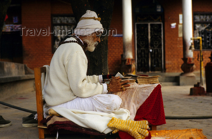 nepal272: Narayanthan village, Kathmandu valley, Nepal: Budhanilkantha temple - Brahmin priest reading - Brahmins are the highest caste (Varna) - Brahmins are priests, but also teachers and scholars of the Veda - photo by W.Allgöwer - (c) Travel-Images.com - Stock Photography agency - Image Bank