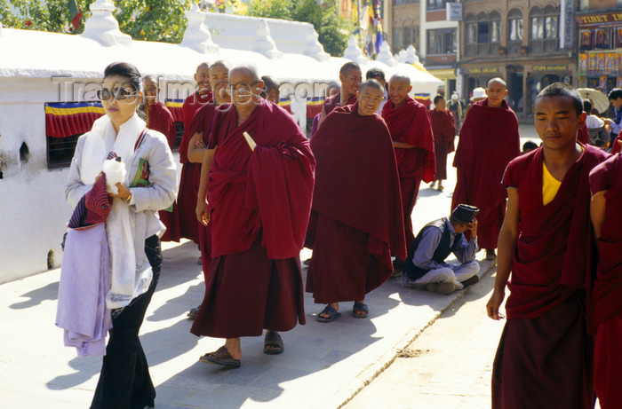 nepal282: Kathmandu valley, Nepal: woman and monks at Bodhnath / Boudhanath temple complex - known to Newars as Khasti Chitya - photo by W.Allgöwer - (c) Travel-Images.com - Stock Photography agency - Image Bank