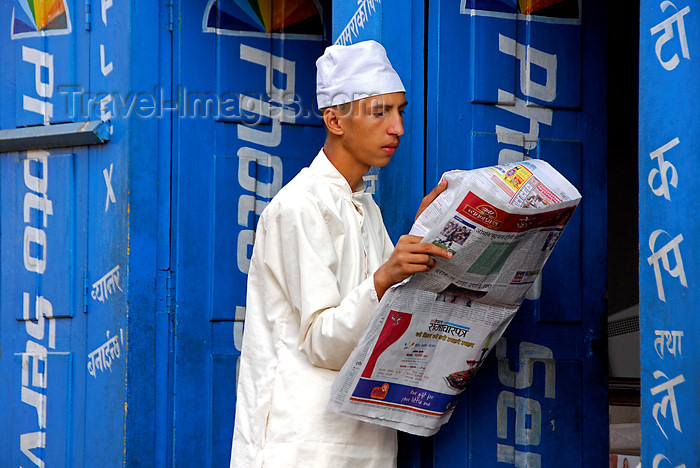 nepal295: Bhaktapur, Bagmati zone, Nepal: man reading newspaper - photo lab - Konica - photo by J.Pemberton - (c) Travel-Images.com - Stock Photography agency - Image Bank