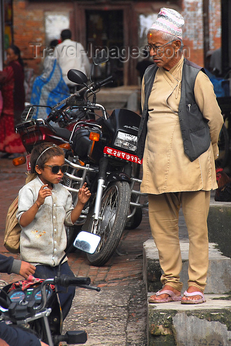 nepal302: Patan, Lalitpur District, Bagmati Zone, Nepal: old traditional man and young modern boy - photo by J.Pemberton - (c) Travel-Images.com - Stock Photography agency - Image Bank