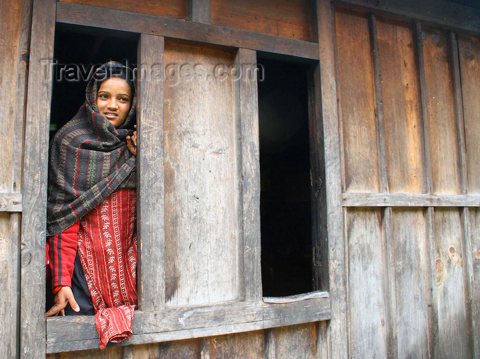nepal311: Annapurna region, Nepal: young woman at a window - photo by M.Wright - (c) Travel-Images.com - Stock Photography agency - Image Bank