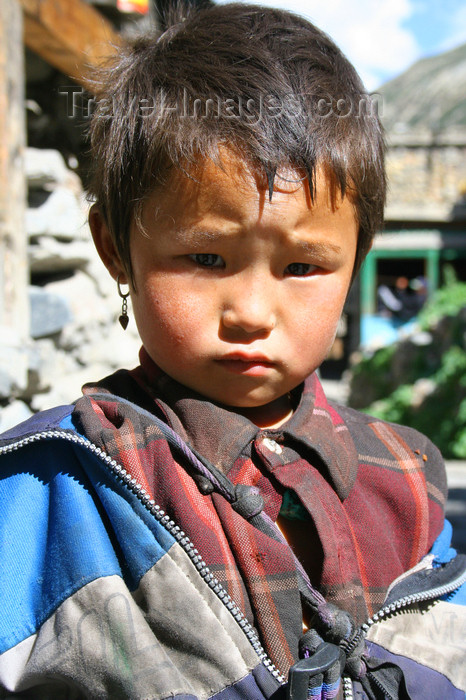 nepal326: Annapurna region, Nepal: girl with sad eyes - photo by M.Wright - (c) Travel-Images.com - Stock Photography agency - Image Bank