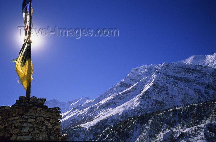 nepal372: Annapurna area, Nepal: small chorten, sun and prayer flags (tarcho) - photo by W.Allgöwer - (c) Travel-Images.com - Stock Photography agency - Image Bank