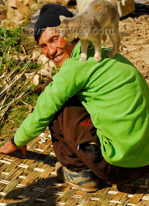 nepal434: Sankhuwasabha District, Kosi Zone, Nepal: cat on the shoulder of a man weaving a bamboo mat - photo by E.Petitalot - (c) Travel-Images.com - Stock Photography agency - Image Bank