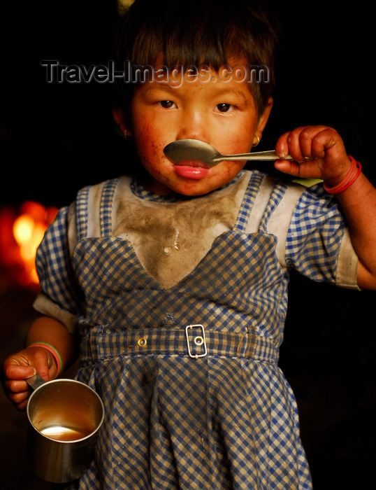 nepal440: Sankhuwasabha District, Kosi Zone, Nepal: a young girl drinks tea - photo by E.Petitalot - (c) Travel-Images.com - Stock Photography agency - Image Bank