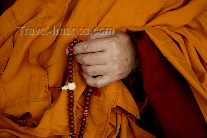 nepal450: Kathmandu, Nepal: monk praying - hand and prayer beads - rosary - photo by G.Koelman - (c) Travel-Images.com - Stock Photography agency - Image Bank
