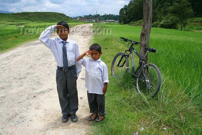 nepal7: Nepal - Kathmandu valley: kids offer a salute - while mountain biking in Kathmandu surrounding mountains - photo by M.Wright - (c) Travel-Images.com - Stock Photography agency - Image Bank