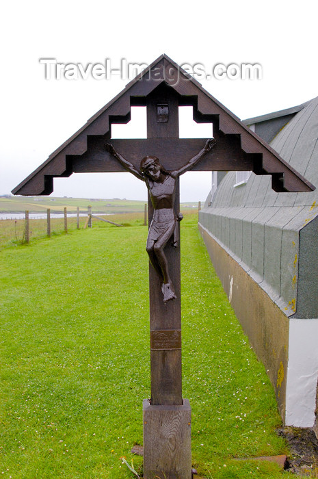 orkney5: Lamb Holm island - The wayside shrine of the Italian Chapel. The carved figure of Christ was a gift from the Commune of Moena in Italy, Chiocchetti's home town.  The shrine was erected in 1961.  The cross and canopy were made in Kirkwall, Orkney. - (c) Travel-Images.com - Stock Photography agency - the Global Image Bank