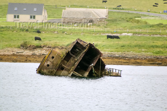 orkney56: Orkney island, Mainland - The rusting hull of a block ship designed as anti submarine protection at the 3rd Churchill Barrier - (c) Travel-Images.com - Stock Photography agency - the Global Image Bank