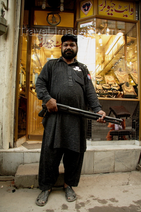 pakistan195: Lahore, Punjab, Pakistan: security guard armed with a shotgun in front of a jeweler - gold  - photo by G.Koelman - (c) Travel-Images.com - Stock Photography agency - Image Bank