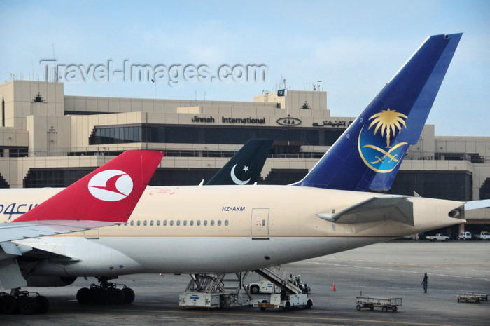 pakistan37: Karachi, Sindh, Pakistan: Jinnah International Airport - KHI - Karachi Airport, former Quaid-e-Azam airport - ICN - crecents and airliners - Turkish Airlines, Pakistan International Airlines, Saudi Arabian Airlines - Boeing 777-268 (ER) HZ-AKM cn 28356 - photo by M.Torres - (c) Travel-Images.com - Stock Photography agency - Image Bank