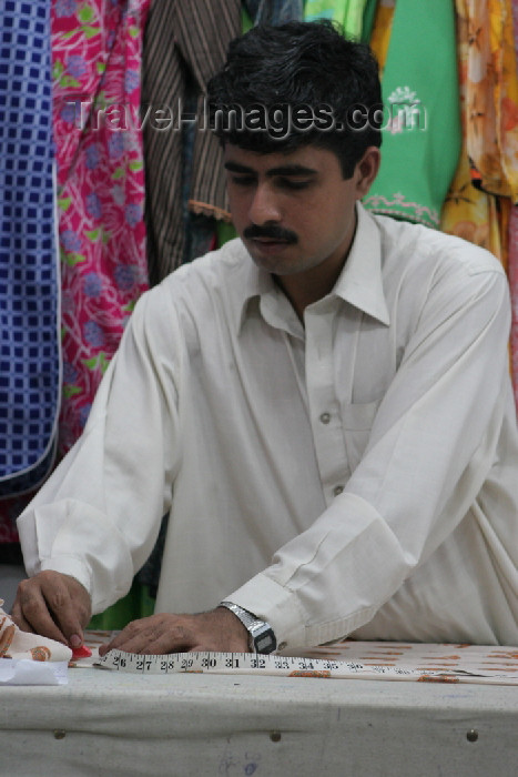 pakistan85: Karachi, Sindh, Pakistan: a young tailor at work - making clothes - photo by R.Zafar - (c) Travel-Images.com - Stock Photography agency - Image Bank