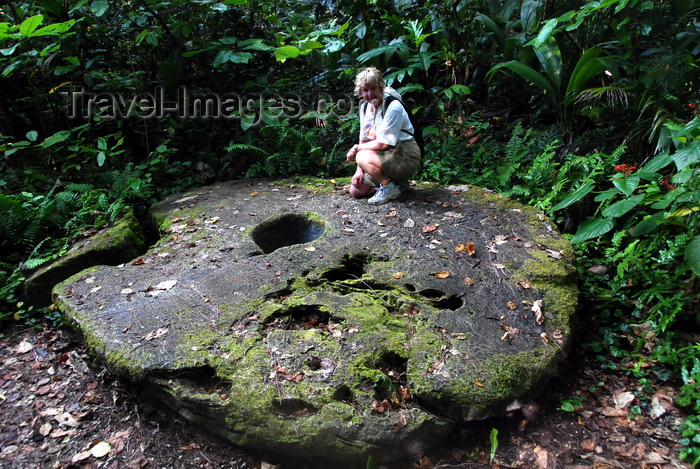 palau15: Airai state, Babeldaob island, Palau: Yap stone Money, which was quarried in Palau - notice the scale - Rai stones - limestone disks - photo by B.Cain - (c) Travel-Images.com - Stock Photography agency - Image Bank