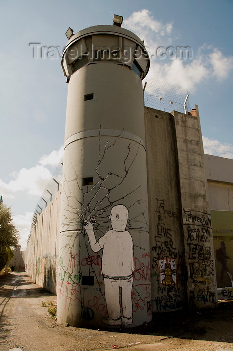 palest32: near Bethlehem, , West Bank, Palestine: graffitti on watchtower - breaking the wall with a single finger - hafrada fence - photo by J.Pemberton - (c) Travel-Images.com - Stock Photography agency - Image Bank
