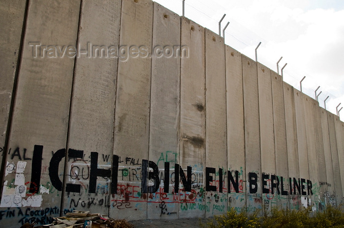 palest34: near Bethlehem, West Bank, Palestine: graffitti on Wall - Kennedy's 'Ich bin ein Berliner' - which can mean 'I am a doughnut' - concrete slabs of the separation fence - photo by J.Pemberton - (c) Travel-Images.com - Stock Photography agency - Image Bank