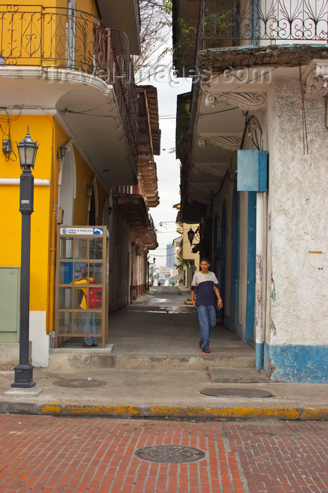 panama139: Panama City: one of the multiple alleys that crisscross the Old Quarter - in the background the modern city skyline through the haze - Casco Viejo, the Old Quarter, is the second city, built after Panama la Vieja was burnt to prevent Sir Henry Morgan from looting it - photo by H.Olarte - (c) Travel-Images.com - Stock Photography agency - Image Bank