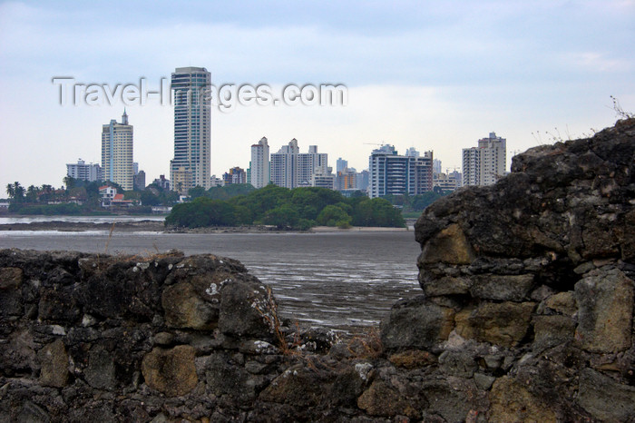 panama140: Panama City: ruins of Panama la Vieja (Old Panama) frame the luxurious buildings of Punta Paitilla, where the merchants and bankers that control Panama live, surrounded by the pollution of the Panama Bay - 

an ongoing project attempts to clean the bay - photo by H.Olarte - (c) Travel-Images.com - Stock Photography agency - Image Bank