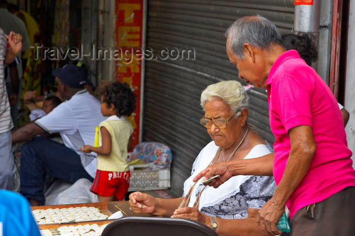 panama149: Panama City: an old woman sells lottery tickets at La Bajada de Salsipuedes - photo by H.Olarte - (c) Travel-Images.com - Stock Photography agency - Image Bank