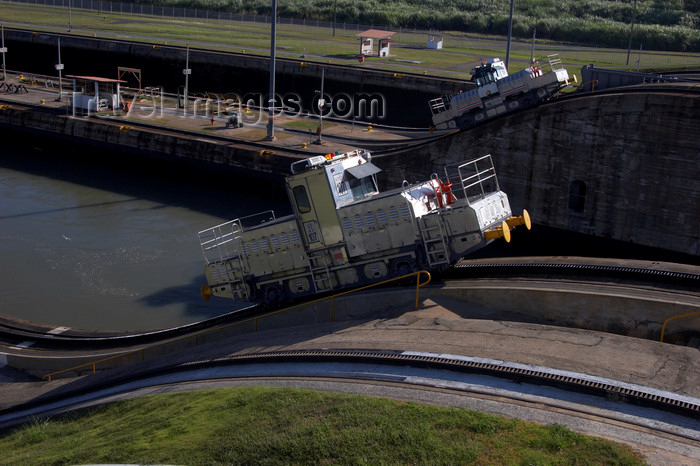 panama237: Panama Canal - Miraflores locks - locomotives used to tow ships along the locks - jump - photo by H.Olarte - (c) Travel-Images.com - Stock Photography agency - Image Bank