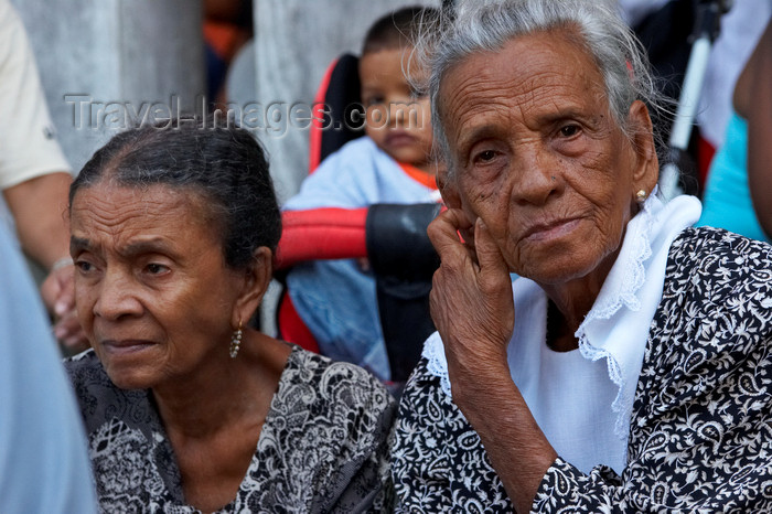 panama303: Two old ladies in traditional mourning clothes watch the dances at the  meeting of congos and devils, Portobello, Colon, Panama, Central America - photo by H.Olarte - (c) Travel-Images.com - Stock Photography agency - Image Bank