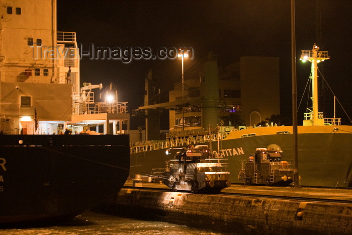 panama505: Panama canal: a mule helps centering a ship during a night transit - Bulk Carrier Sanko Titan, IMO: 9298545 - photo by H.Olarte - (c) Travel-Images.com - Stock Photography agency - Image Bank