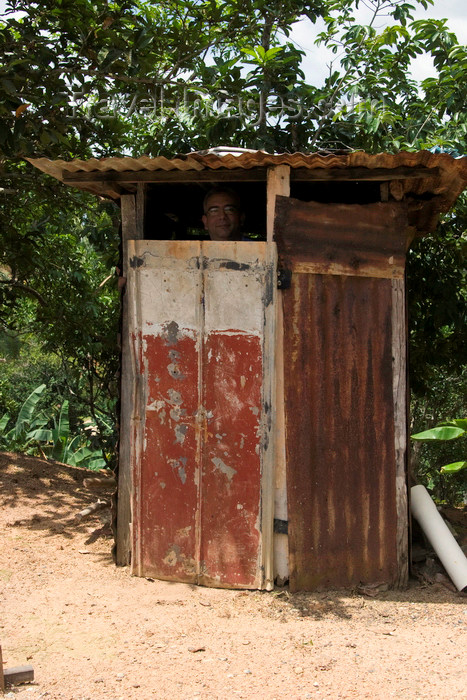 panama516: Capira, Panama province: man looking out from an outhouse - basic restroom - photo by H.Olarte - (c) Travel-Images.com - Stock Photography agency - Image Bank