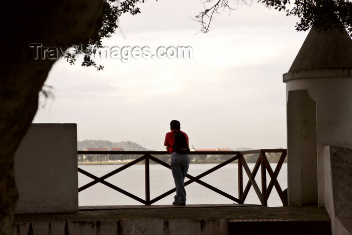 panama90: Panama City: a man looks at Panama Bay towards the Amador Area - guerite at Plaza de Francia, Casco Viejo - photo by H.Olarte - (c) Travel-Images.com - Stock Photography agency - Image Bank