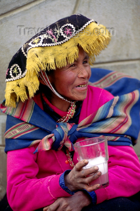 peru138: Ausangate massif, Cuzco region, Peru: Quechua woman drinks the local brew in a rural town - Chicha de jora, a fermented beverage derived from maize - photo by C.Lovell - (c) Travel-Images.com - Stock Photography agency - Image Bank
