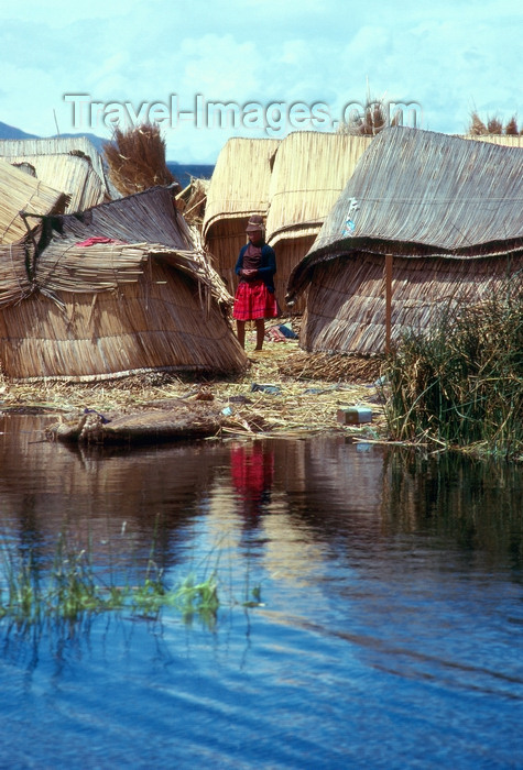 peru43: Lake Titicaca - Puno region, Peru: Uros girl on a floating islet - indigenous village - photo by J.Fekete - (c) Travel-Images.com - Stock Photography agency - Image Bank