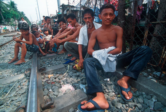 phil21: Manila city, Philippines - youths on the railway tracks - Slums and shanty towns - photo by B.Henry - (c) Travel-Images.com - Stock Photography agency - Image Bank