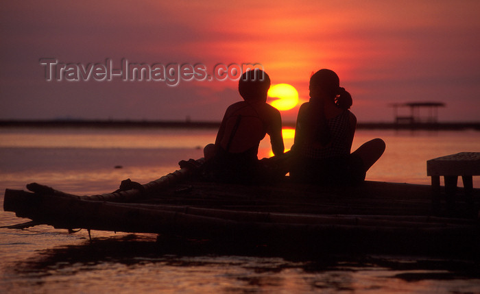 phil32: Philippines - Beach - the day concludes with a perfect sunset - watching the sunset from a platform over the water - vacations  - (c) Travel-Images.com - Stock Photography agency - Image Bank
